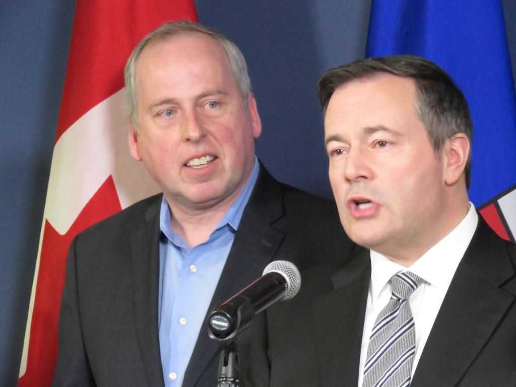 Len Rhodes, left, the former CEO of the Edmonton Eskimos football team, stands with United Conservative Leader Jason Kenney Thursday to announce Rhodes will run as a UCP candidate in Alberta's upcoming election at a press conference in Edmonton on Thursday, Feb. 21, 2019. THE CANADIAN PRESS/Dean Bennett.