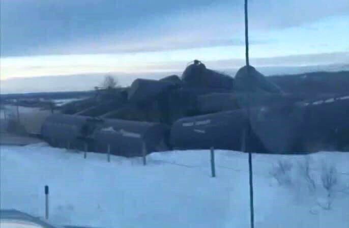 Train cars in a pile near St Lazare, Man.