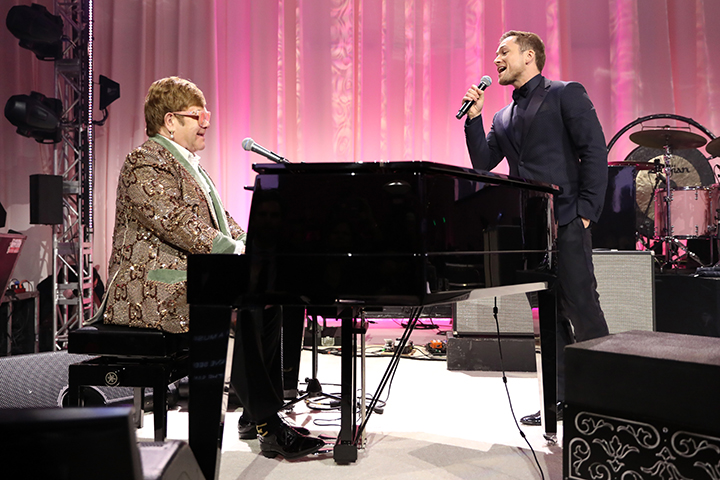 Sir Elton John and Taron Egerton perform onstage during the 27th annual Elton John AIDS Foundation Academy Awards Viewing Party on Feb. 24, 2019, in West Hollywood, Calif.