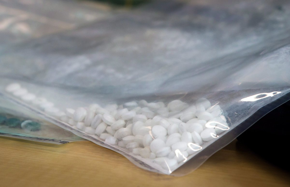 Fake Oxycontin pills containing fentanyl are displayed during a news conference at RCMP headquarters in Surrey, B.C., on Thursday, September 3, 2015. 
