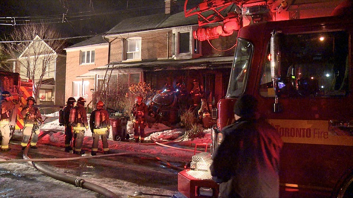 Toronto firefighters on scene of an overnight house fire in the area of Dupont and Ossington.