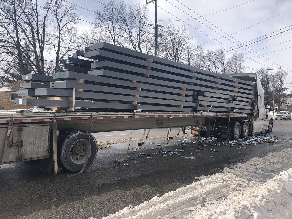 The steel beams slid into the cab of the flatbed truck following a collision with another vehicle on Tuesday afternoon. 