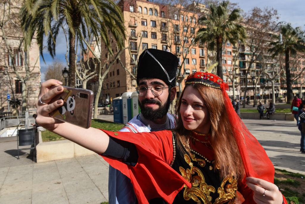 BARCELONA, SPAIN – 2019/02/02: A couple poses for a selfie picture during the celebration of the Chinese Lunar New Year in Barcelona. The Chinese Lunar New Year, the Year of the Pig, begins on February 5 2019 and ends on January 24 2019. (Photo by John Milner/SOPA Images/LightRocket via Getty Images)