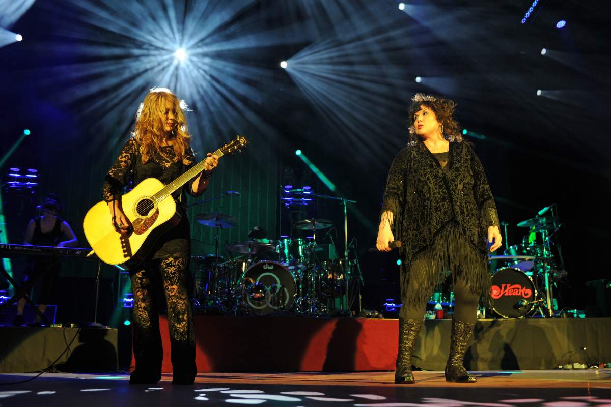 (L-R) Nancy Wilson, Jason Bonham and Ann Wilson of Heart perform on the opening night of their U.S. tour at Cruzan Amphitheatre on June 17, 2013, in West Palm Beach, Fla.