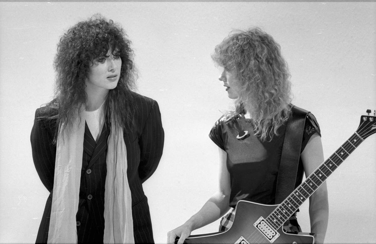 (L-R) Ann Wilson and Nancy Wilson of Heart in a film still from a music video in circa 1982 in Los Angeles, Calif.