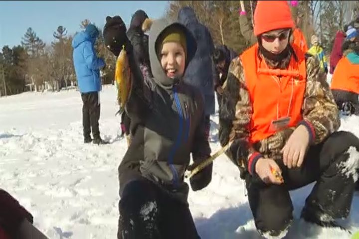 Hundreds reel in the fun at free family ice fishing day on Chemong Lake