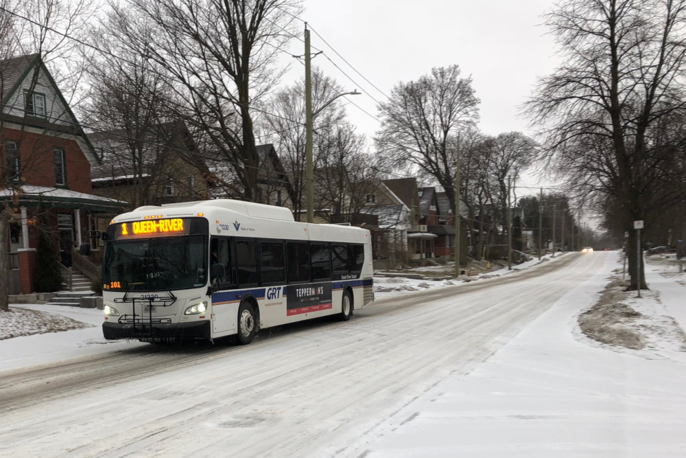 A Grand River Transit bus travels down Krug Street in Kitchener during a winter storm.