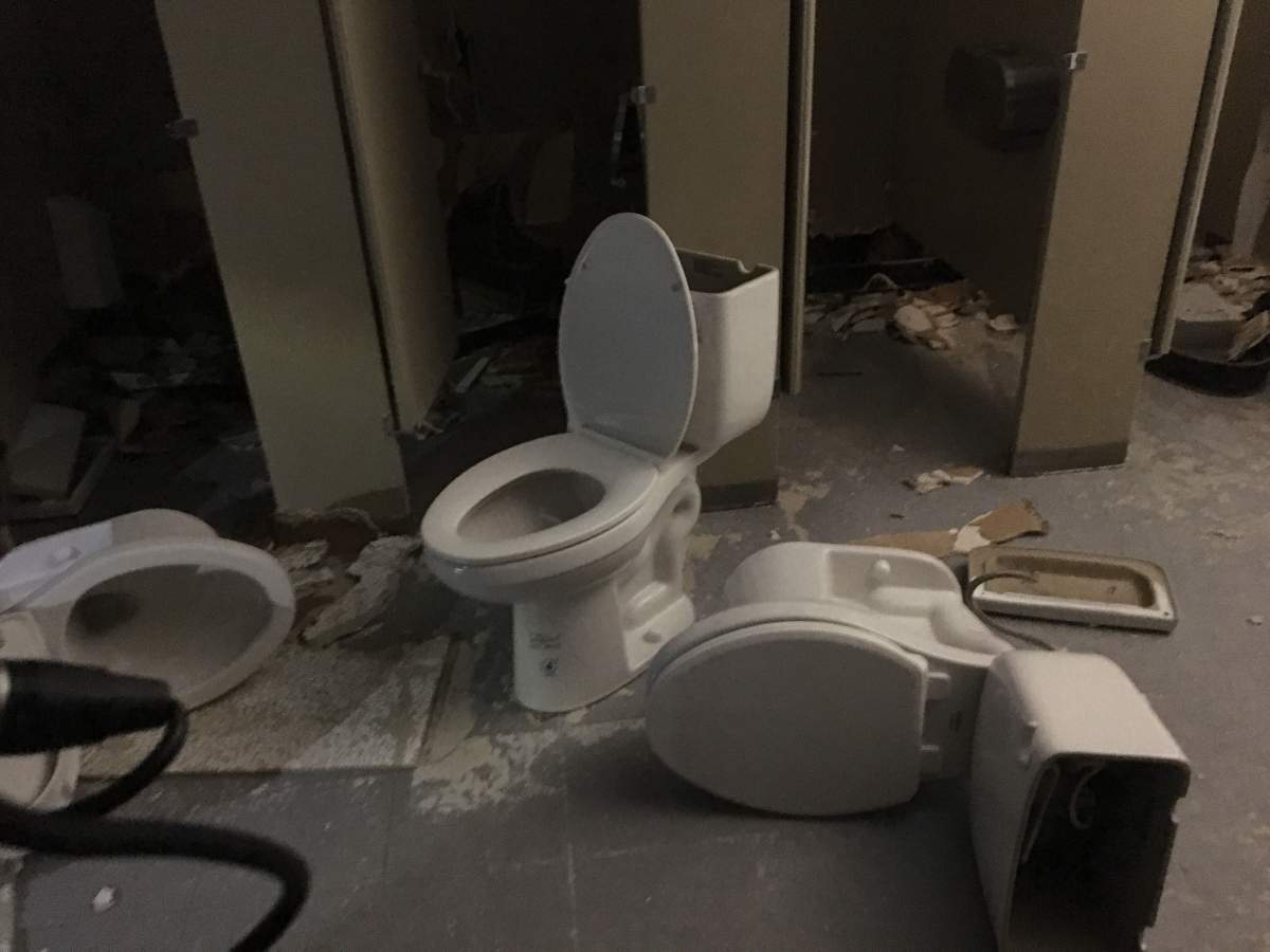 Toilets smashed on the floor.
