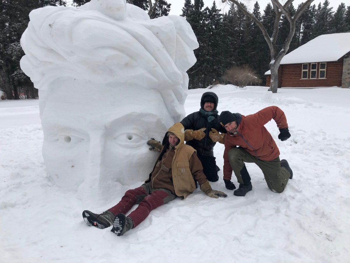 James Culleton, and Chris Pancoe pose in front of one out of four new ice sculptures standing at Riding Mountain National Park.