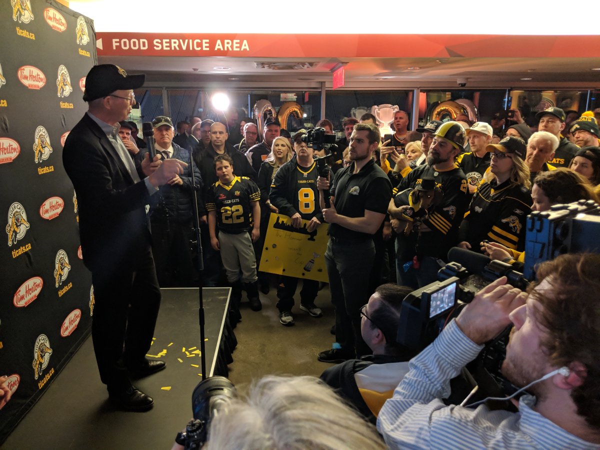 Fans gather to listen to Tiger-Cats owner Bob Young on the club level of Tim Hortons Field during a Tiger-Cats-hosted viewing party after the Canadian Football League announced that the 2021 Grey Cup will be hosted by Hamilton.