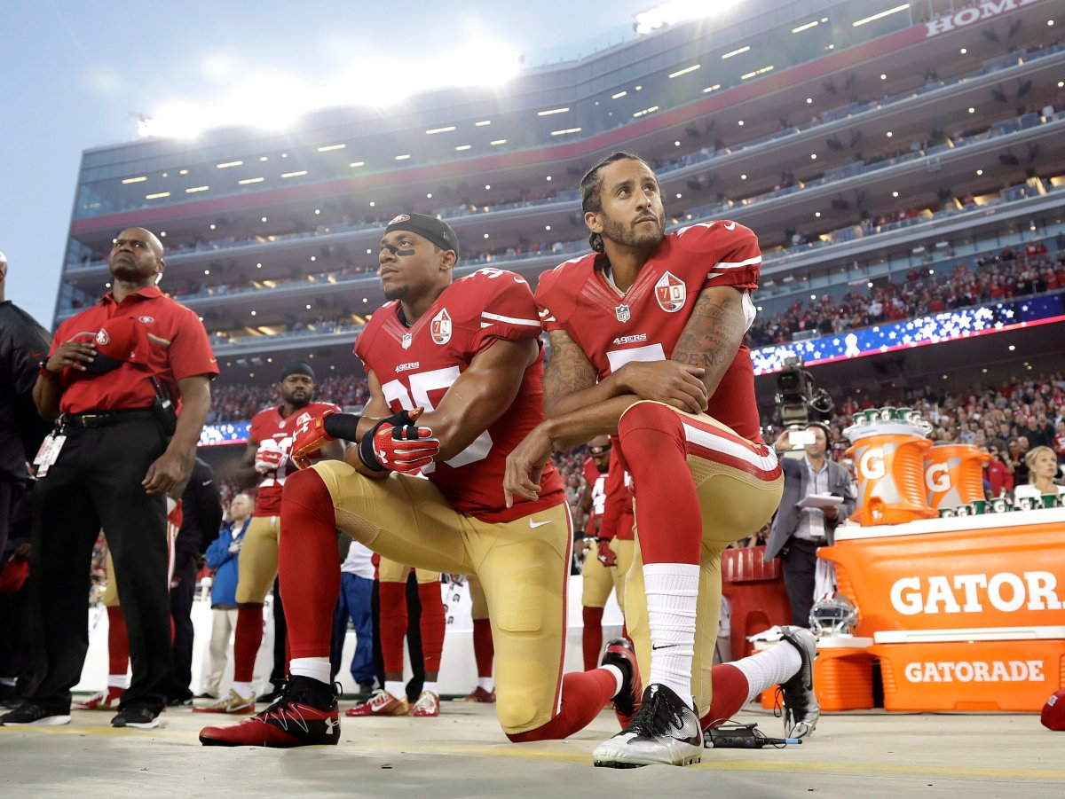 In this Sept. 12, 2016, file photo, San Francisco 49ers safety Eric Reid (35) and quarterback Colin Kaepernick (7) kneel during the national anthem before an NFL football game against the Los Angeles Rams in Santa Clara, Calif.