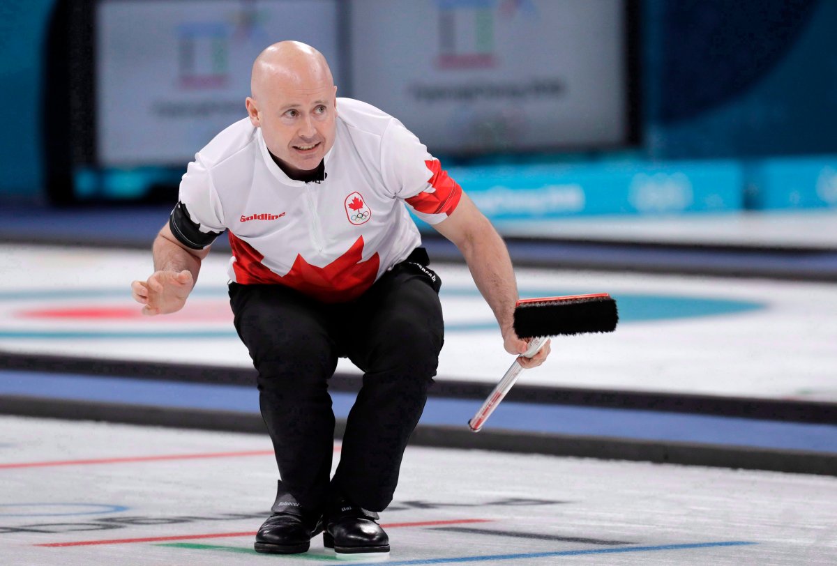 File: Canada's skip Kevin Koe gestures during the men's curling match against Switzerland at the 2018 Winter Olympics in Gangneung, South Korea, Friday, Feb. 23, 2018. 