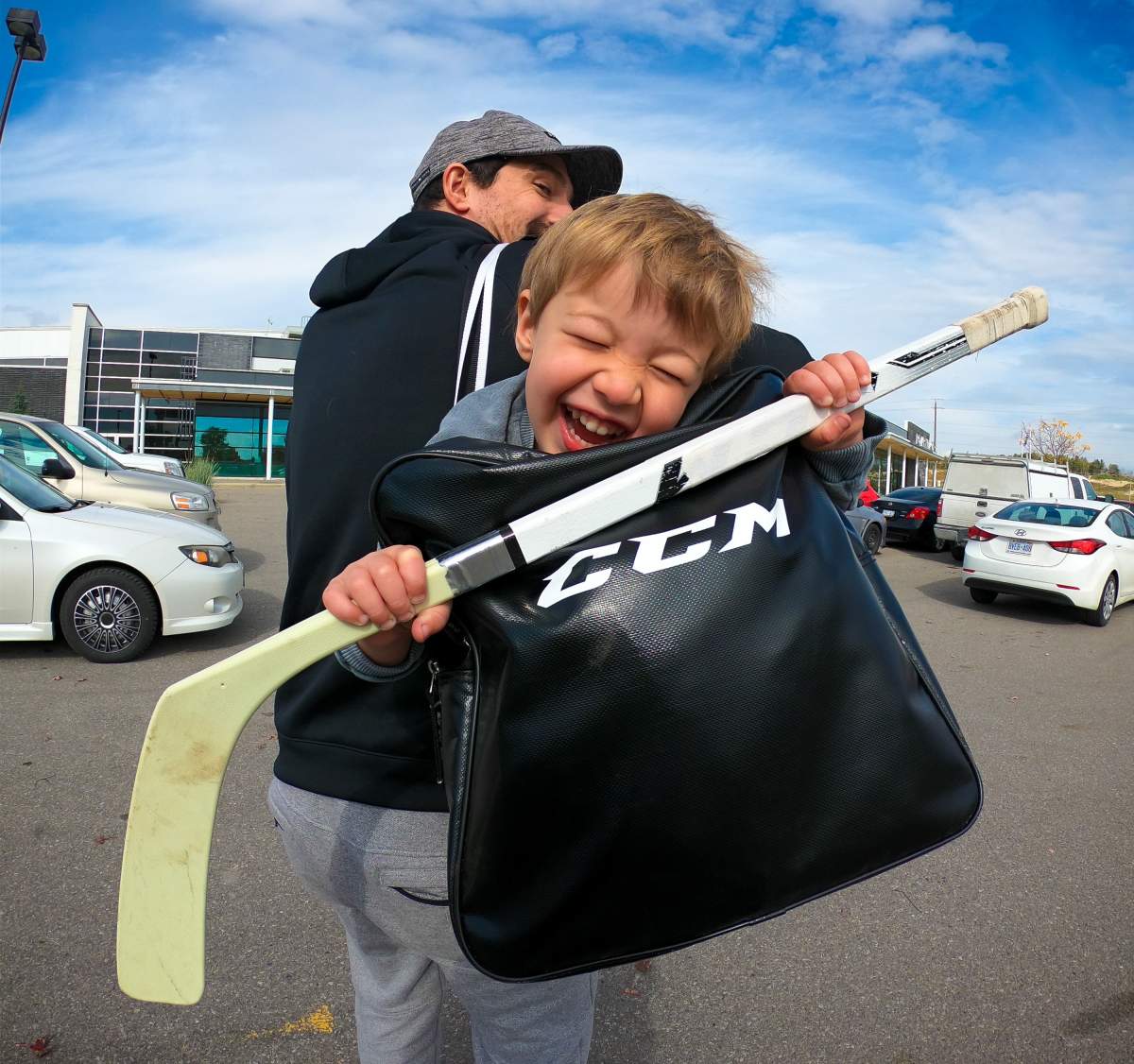 Jeremy Rupke and his four-year-old son Mason heading to practice.