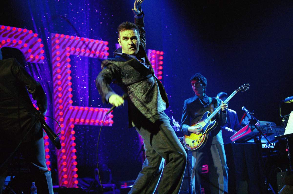 (L-R) Boz Boorer, Morrissey, Barrie Cadoga and Mike Farrell performing live onstage at Meltdown Festival in London, England.