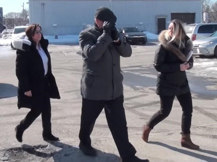 In this image taken from video, police take Mario Monette into custody in Longueuil, Que.