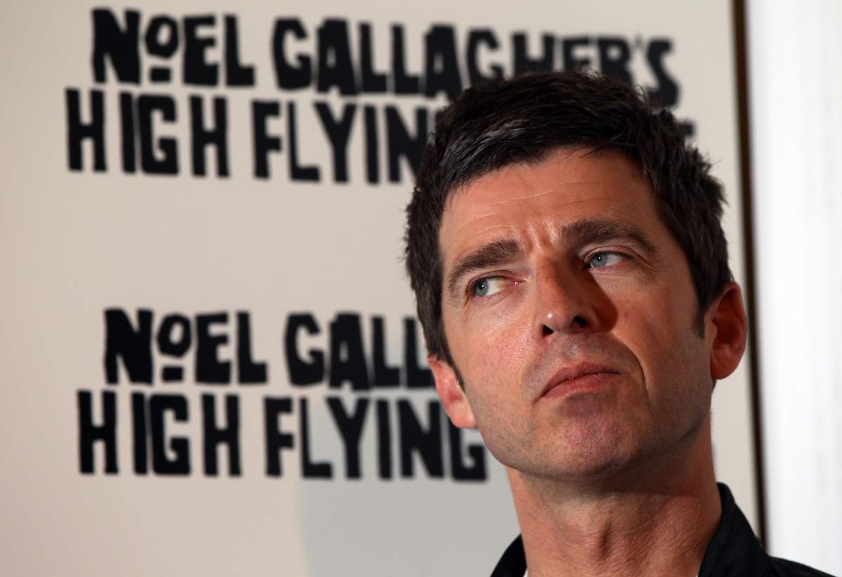 Former Oasis guitarist and songwriter Noel Gallagher poses for a photograph following a press conference announcing a new album in London, on July 6, 2011.