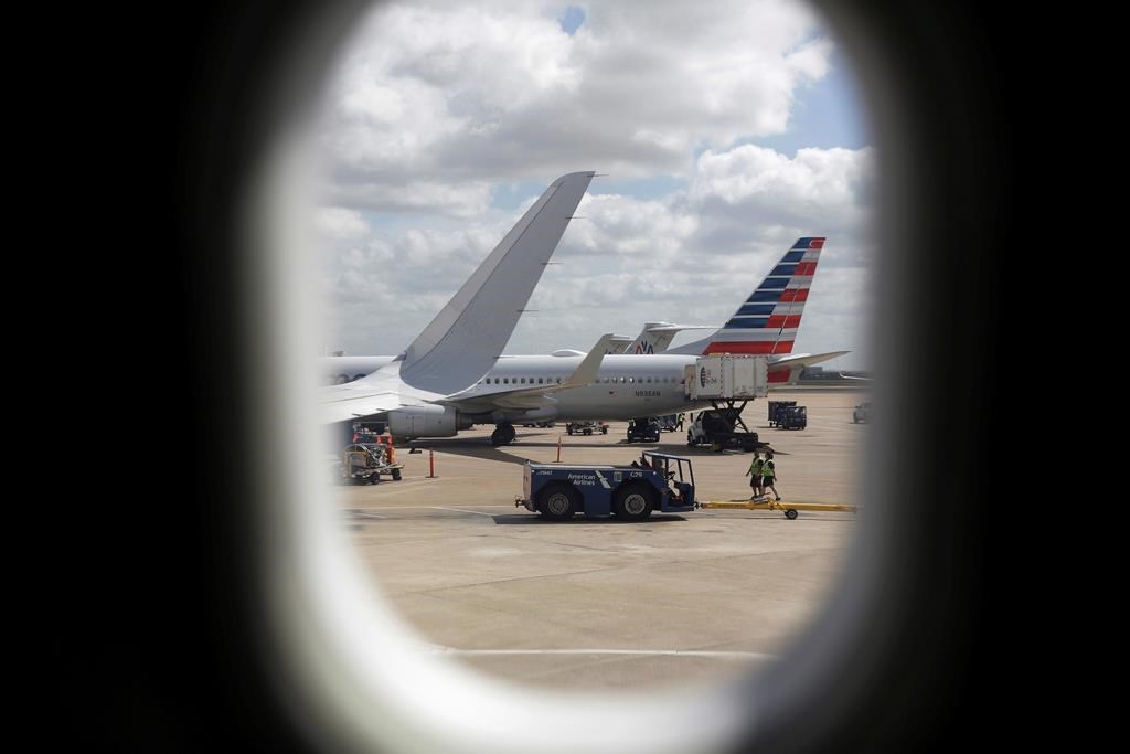 FILE- In this June 16, 2018, file photo, American Airlines aircrafts aircrafts are seen at O"Hare International Airport in Chicago.