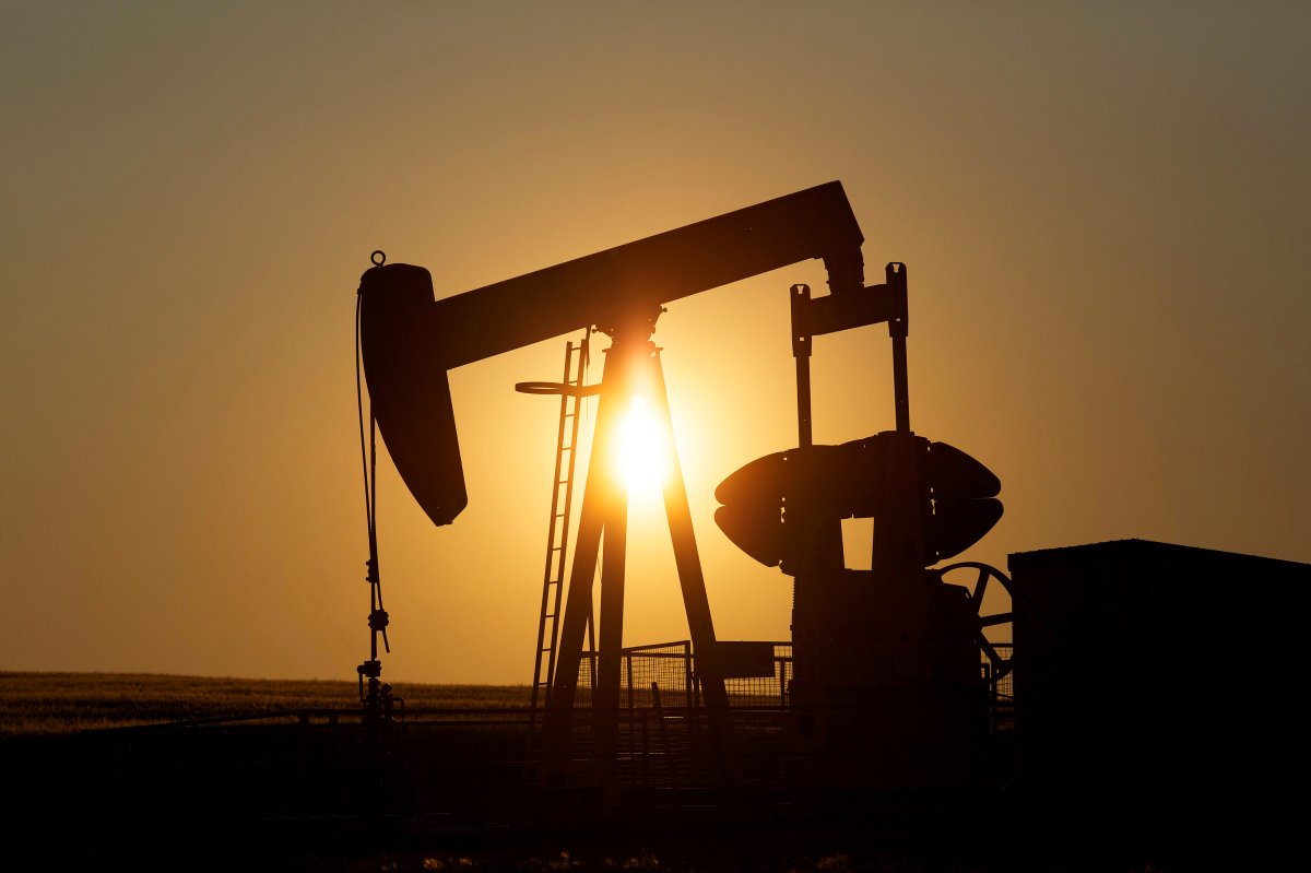 FILE PHOTO: An oil pump jack pumps oil in a field near Calgary, Alberta, Canada on July 21, 2014.