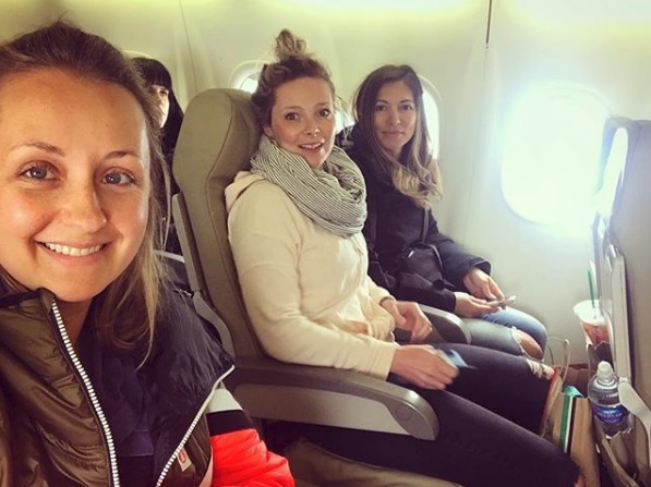 Nicole Clark and two friends on their flight back to Toronto after two days of delays.