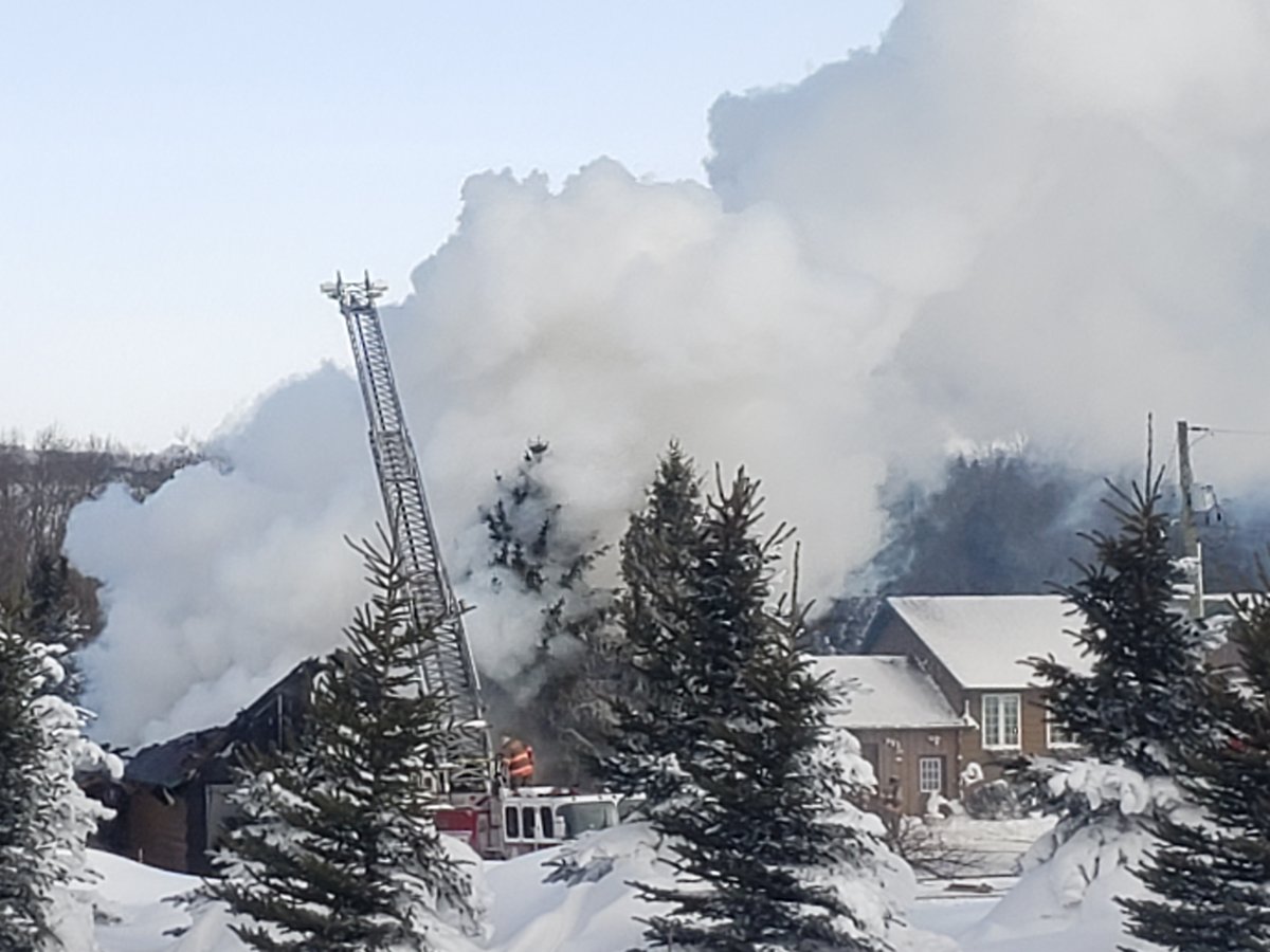 Officials say a fire that destroyed a building in Centre Wellington Township on Tuesday is not considered suspicious. 