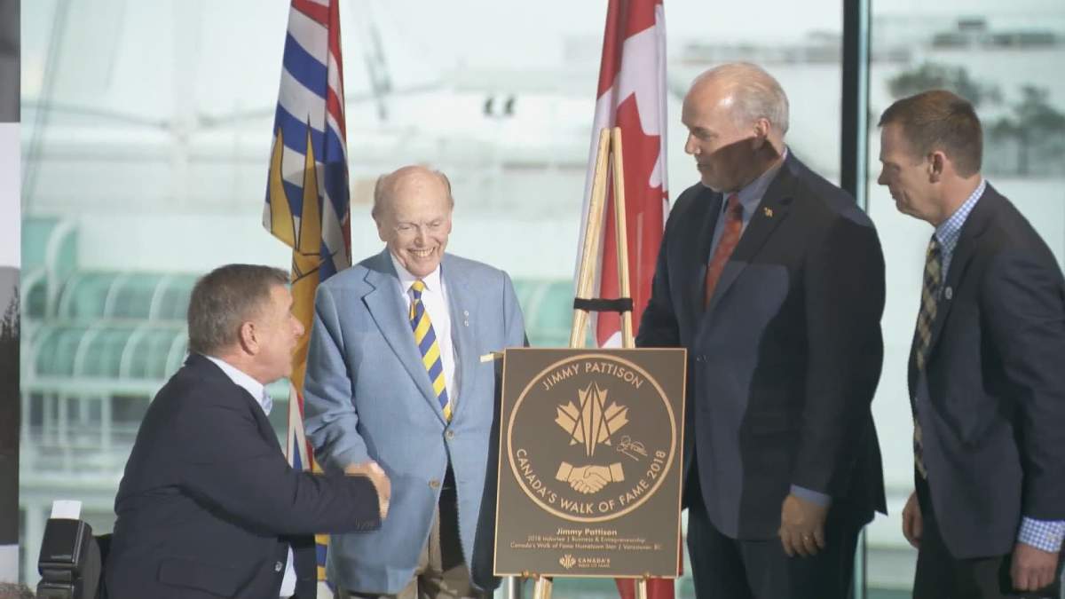 Premier John Horgan and Rick Hansen appear with Jim Pattison as he is honoured with with induction into the Walk of Fame.