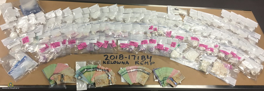 Nearly two kilograms of illicit drugs and more than $15,000 in cash was found during an April drug bust in Kelowna. 