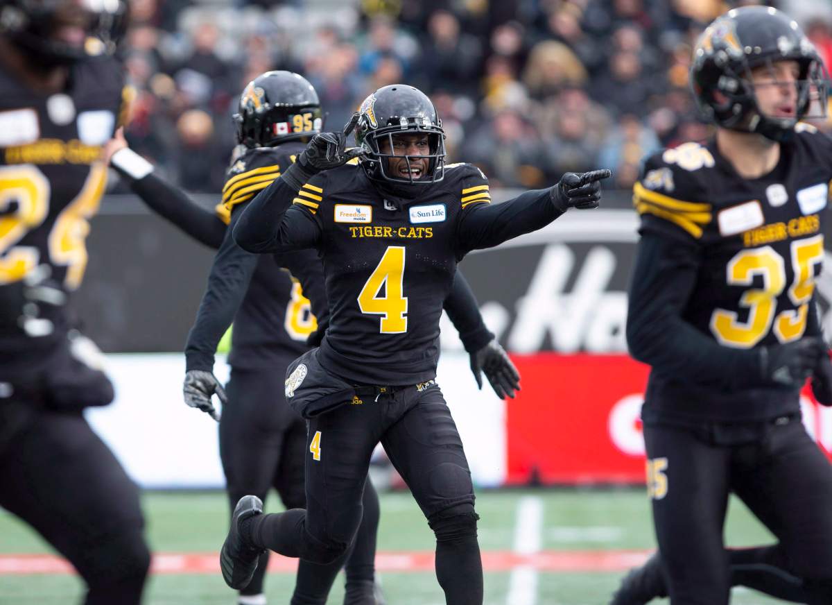 Hamilton Tiger-Cats defensive back Richard Leonard (4) celebrates with his teammates after the defence stopped the B.C. Lions on third down during first half CFL Football division semifinal game action in Hamilton, Ont. on Sunday, November 11, 2018.