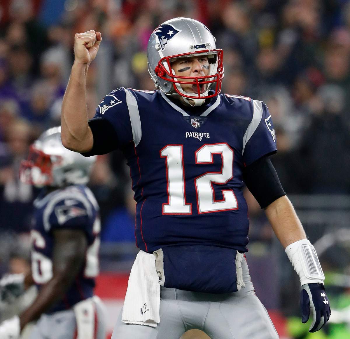FILE – In this Dec. 2, 2018, file photo, New England Patriots quarterback Tom Brady celebrates a touchdown during an NFL football game against the Minnesota Vikings at Gillette Stadium in Foxborough, Mass.