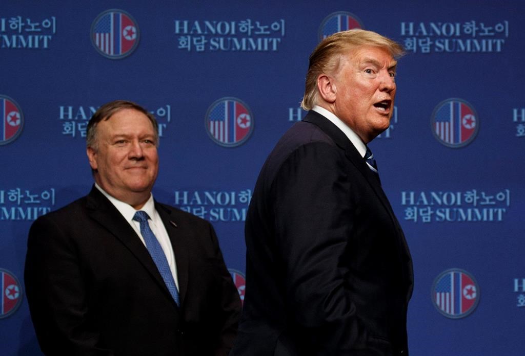 U.S. President Donald Trump, with Secretary of State Mike Pompeo, concludes a news conference after a summit with North Korean leader Kim Jong Un, Thursday, Feb. 28, 2019.