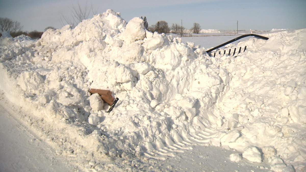 A fence on the city’s property sits covered in snow just of Lyle Street in St. James.