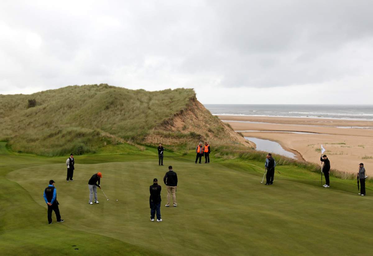 FILE - Donald Jr playing a round of golf on the Trump International Golf Links course near Aberdeen, after it was officially opened this morning.