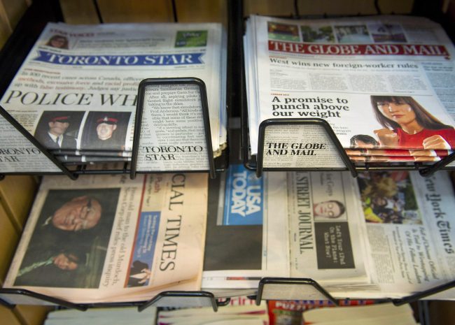 Stacks of The Globe and Mail and the Toronto Star sit in a news stand in Toronto on April 26, 2012. 
