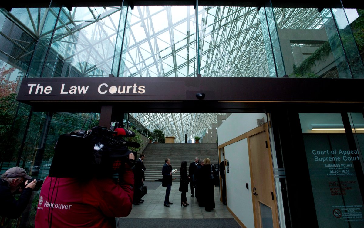 People line up to be screened to enter the British Columbia Supreme Court  in 2013 for the trial of the 2007 Surrey mass murder that left six dead.