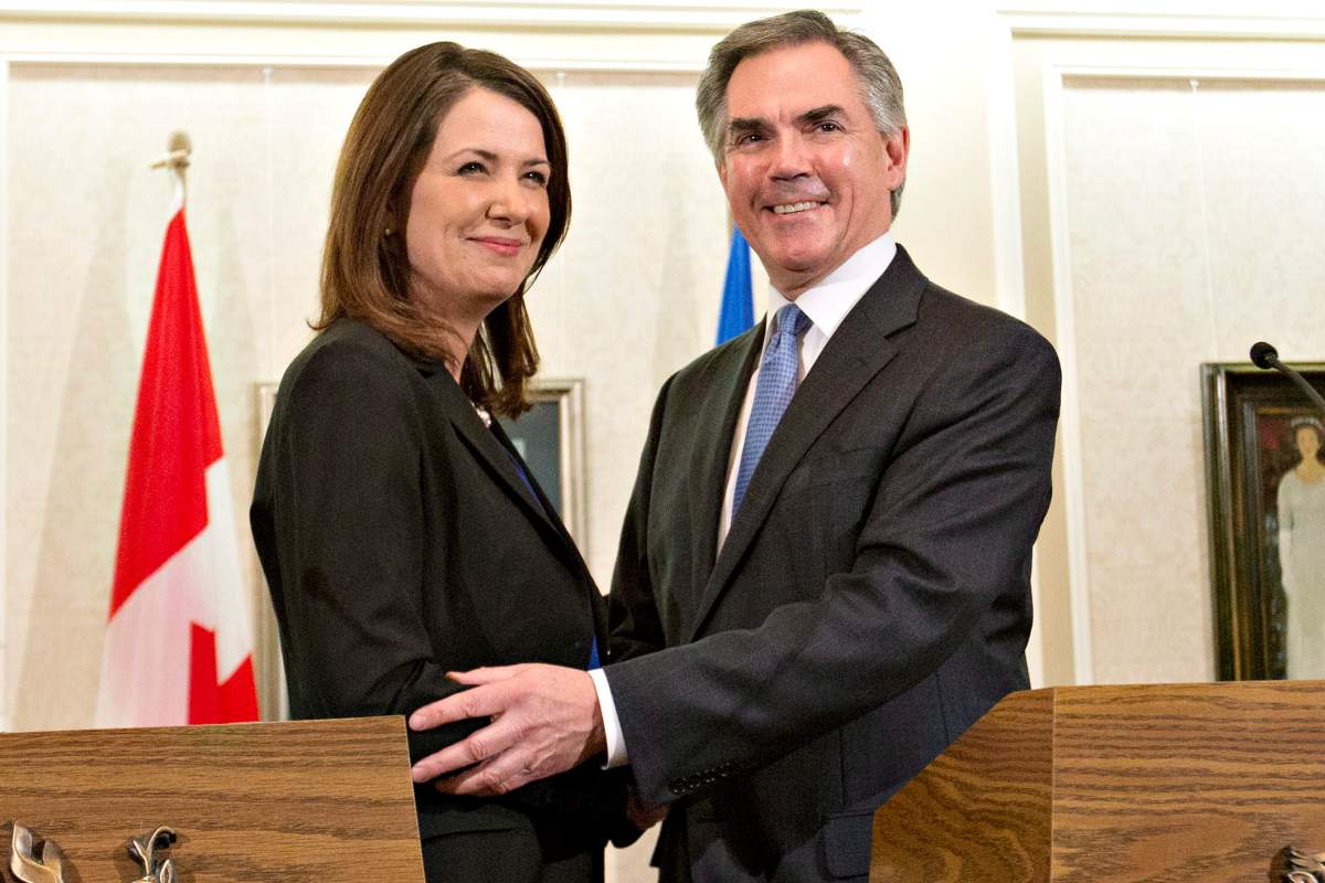Alberta Premier Jim Prentice and former Wildrose Leader Danielle Smith speak to media after a caucus meeting in Edmonton Alta., Wednesday, December 17, 2014.