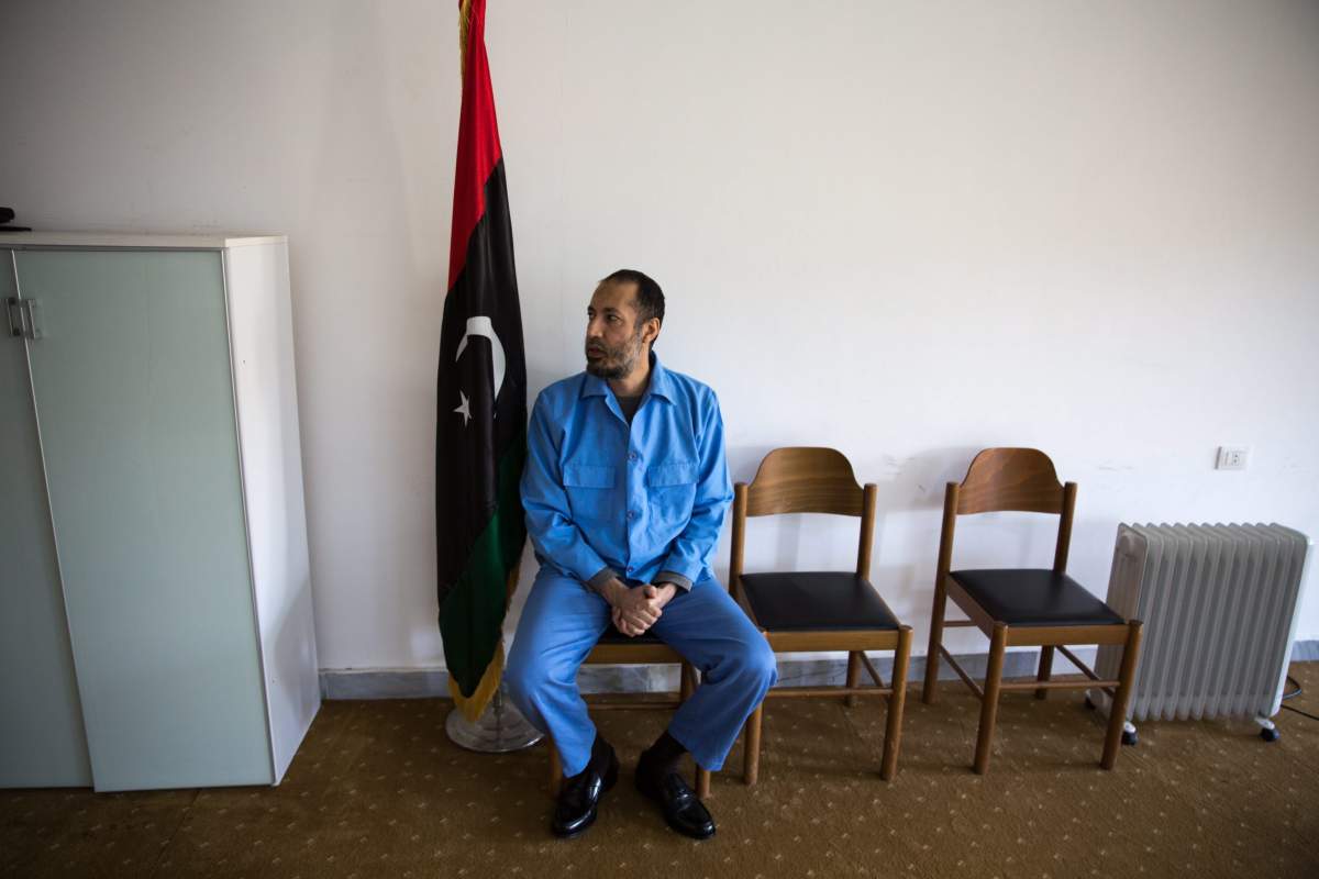Saadi Gaddafi waits outside a courtroom in Tripoli, Libya, Dec. 6, 2015. EPA/STRINGER