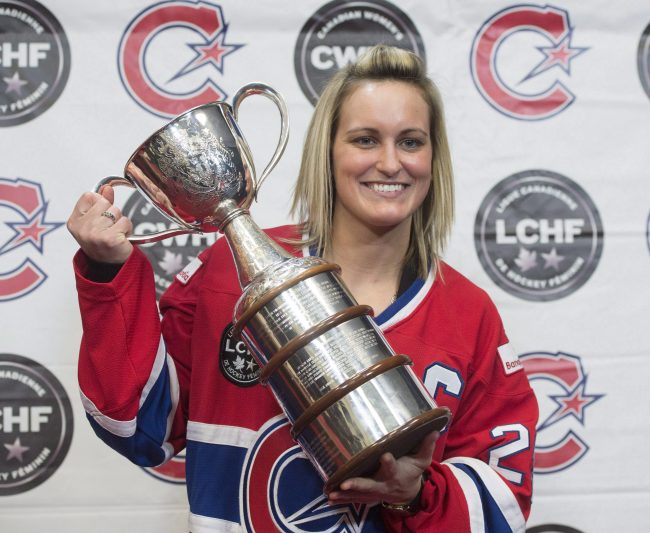 In this March 8, 2017, file photo, Canadiennes captain Marie-Philip Poulin poses for photos with the Clarkson Cup in Brossard, Que.