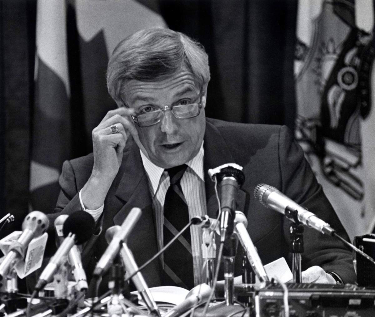 Premier Peter Lougheed of Alberta fielding questions at a news conference in file photo from 1984.
