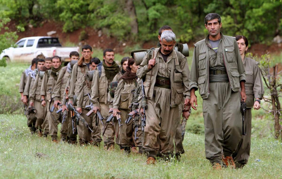 PKK fighters enter northern Iraq, May 14, 2013. (AP Photo/Ceerwan Aziz, File)