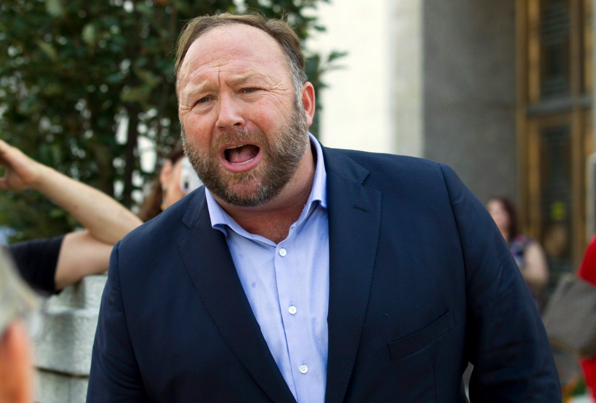In this Sept. 5, 2018, file photo conspiracy theorist Alex Jones speaks outside of the Dirksen building of Capitol Hill after listening to Facebook COO Sheryl Sandberg and Twitter CEO Jack Dorsey testify before the Senate Intelligence Committee on 'Foreign Influence Operations and Their Use of Social Media Platforms' on Capitol Hill in Washington.