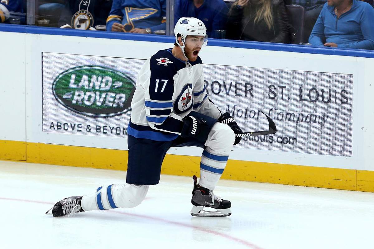 Winnipeg Jets center Adam Lowry (17) celebrates after scoring an unassisted goal during the third period of the team's NHL hockey game against the St. Louis Blues, Thursday, Oct. 4, 2018, in St. Louis. 