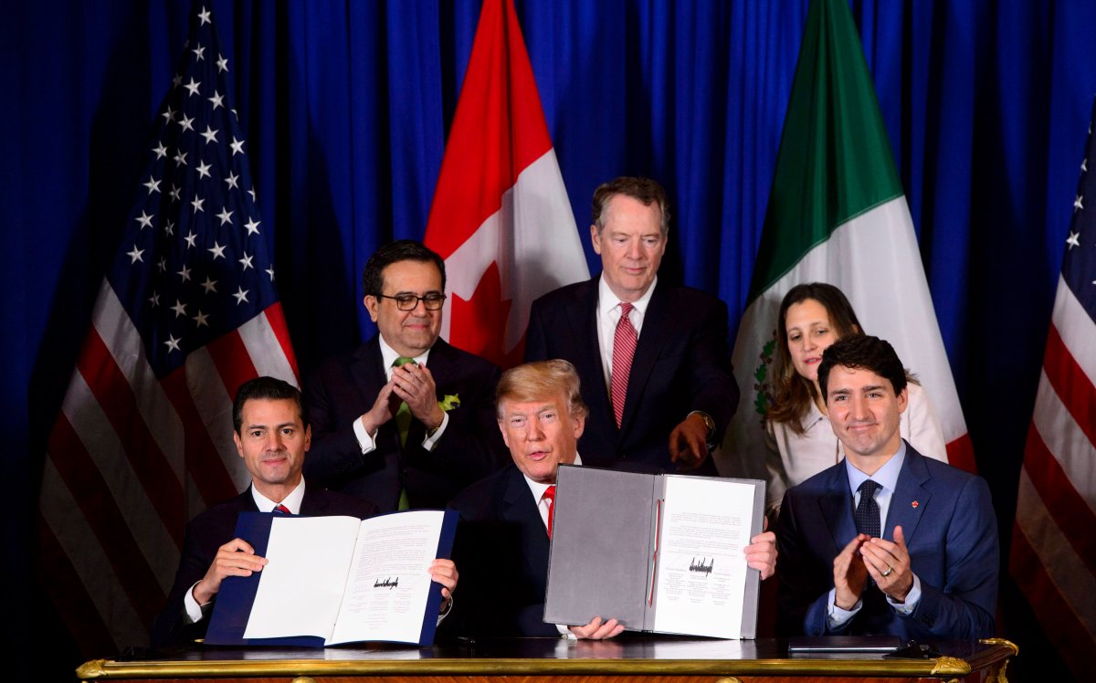 Prime Minister Justin Trudeau, right to left, Foreign Affairs Minister Chrystia Freeland, United States Trade Representative Robert Lighthizer, President of the United States Donald Trump, Mexico's Secretary of Economy Ildefonso Guajardo Villarreal, and President of Mexico Enrique Pena Nieto participate in a signing ceremony for the new United States-Mexico-Canada Agreement in Buenos Aires, Argentina on Friday, Nov. 30, 2018. 