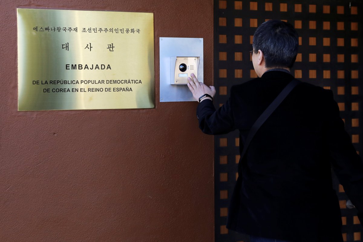 A journalist from South Korea rings an intercom of North Korea's embassy in Madrid, Spain February 28, 2019. 