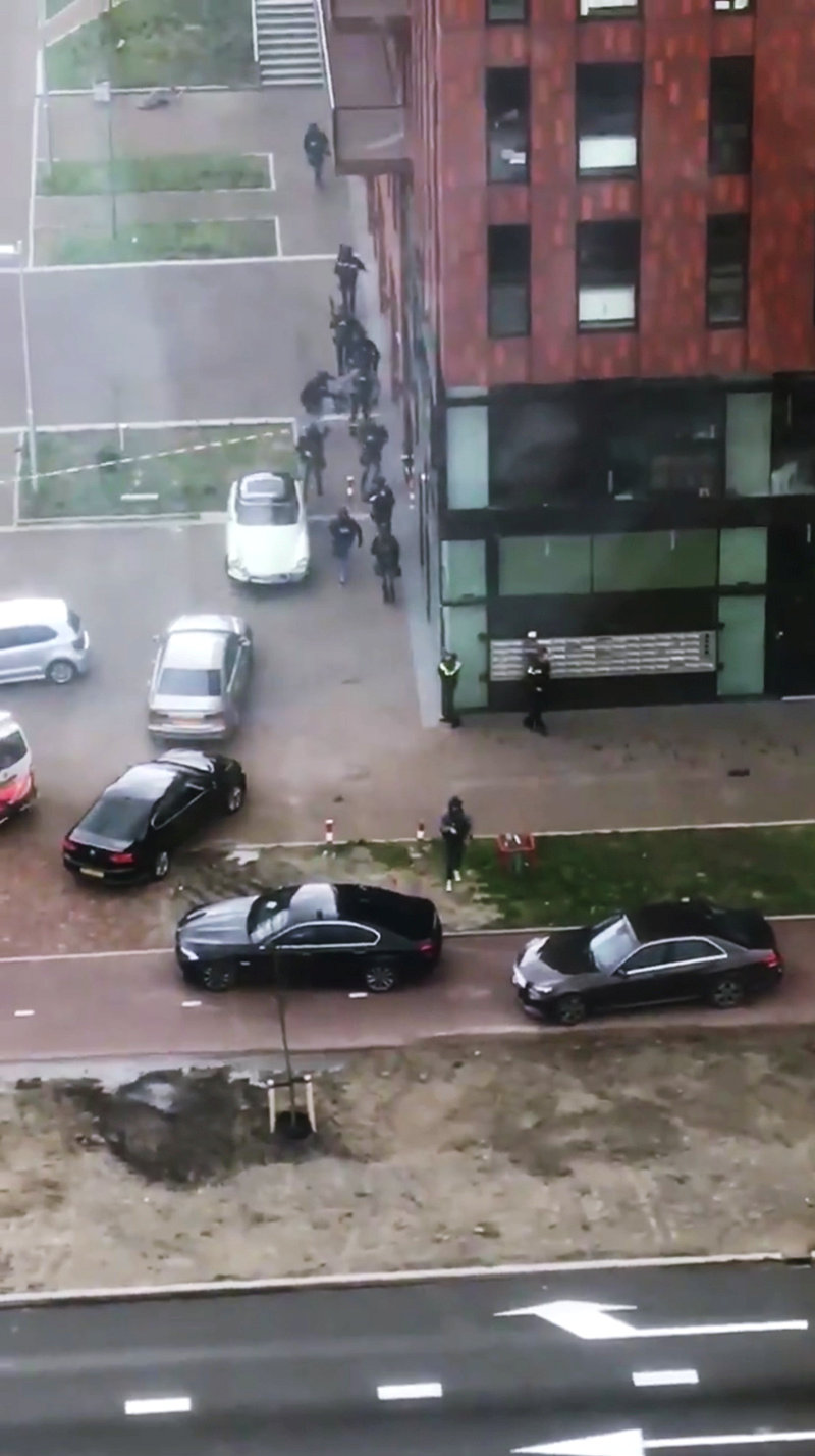 Security officers control a building after a shooting in Utrecht, Netherlands, March 18, 2019, in this still image taken from a social media video.