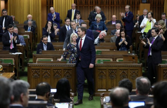 Conservative Party leader Andrew Scheer walks out in protest as Finance Minister Bill Morneau delivers the budget in the House of Commons on Parliament Hill in Ottawa, March 19, 2019.