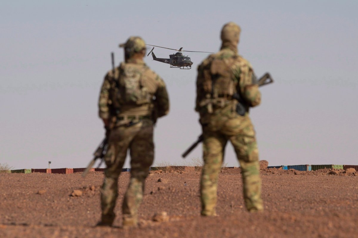 Canadian soldiers watch as a Canadian helicopter provides air security during a demonstration for Prime Minister Justin Trudeau on the United Nations base in Gao, Mali Saturday December 22, 2018. 