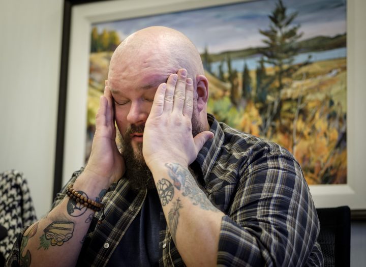 Former Syyncrude firefighter Michael Swan struggles with his emotions as he talks about his situation in Calgary, Alta., Monday, Jan. 14, 2019. A lawsuit filed by a former firefighter and paramedic against Syncrude Canada claims the oilsands giant wrongfully denied him benefits and fired him after he was diagnosed with post-traumatic stress disorder related to his job. 