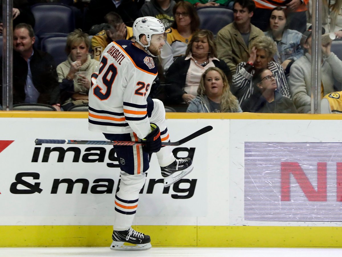 Edmonton Oilers center Leon Draisaitl, of Germany, celebrates after scoring a goal against the Nashville Predators in the first period of an NHL hockey game Monday, Feb. 25, 2019, in Nashville, Tenn. (AP Photo/Mark Humphrey).