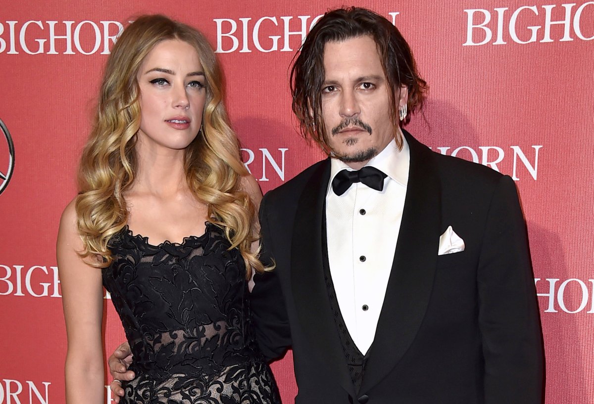 FILE - In this Jan. 2, 2016, file photo, Amber Heard, left, and Johnny Depp arrive at the 27th annual Palm Springs International Film Festival Awards Gala in Palm Springs, Calif.