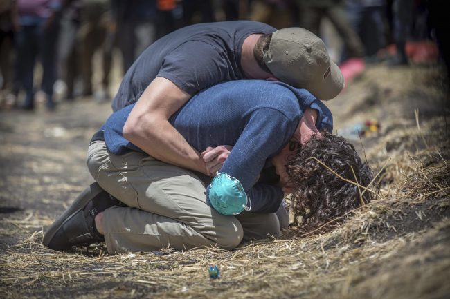 Relatives react at the at the site of the Ethiopian Airlines plane crash south of Addis Ababa, Ethiopia, March 13, 2019.
