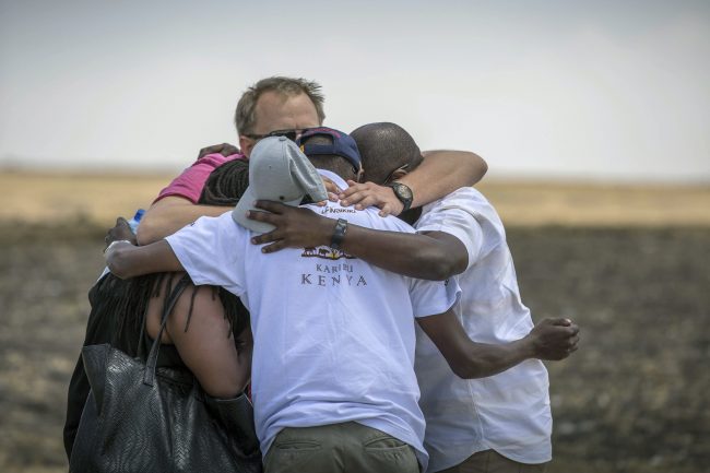 Family members and friends hug at the scene where the Ethiopian Airlines Boeing 737 Max 8 crashed shortly after takeoff on Sunday killing all 157 on board, near Bishoftu, south of Addis Ababa, in Ethiopia, March 13, 2019.